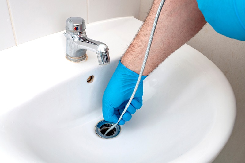 How to Snake a Drain: Taming the Plumbing Serpent