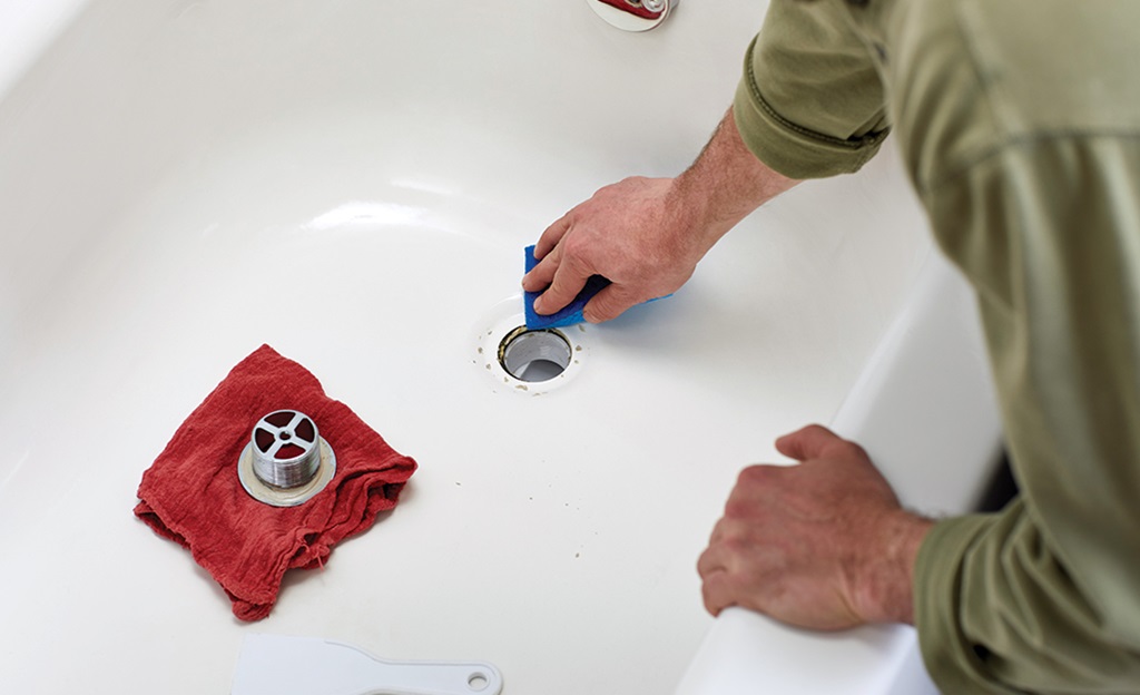 How do you remove a clogged bathtub drain?